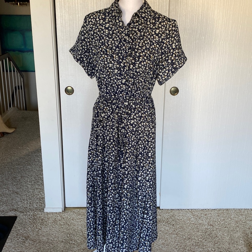 Ditsy button-down collared floral midi dress with white flowers.